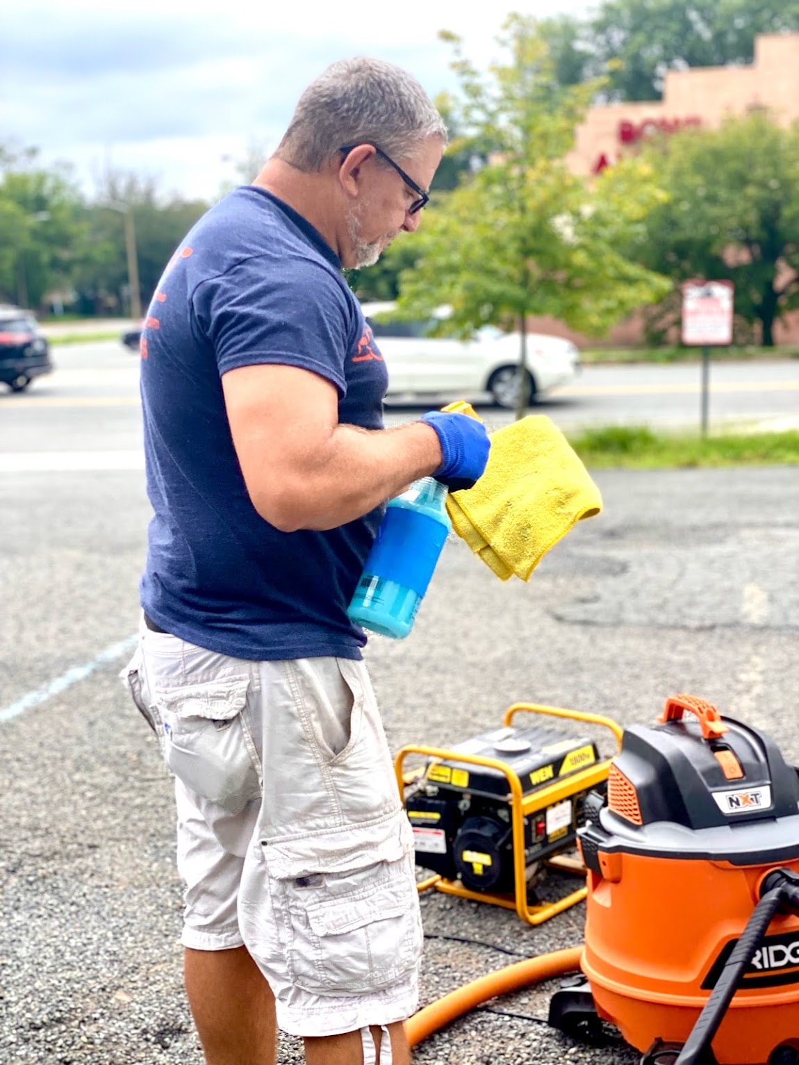 AGV Mobile Car Detailing — Alberto preparing detailing supplies and equipment on location