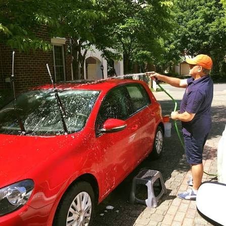 AGV Mobile Car Detailing — professional detailer washing a car on location in Northern Virginia