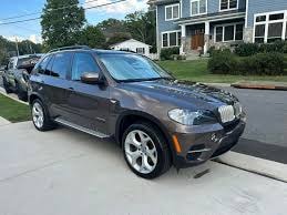 AGV Mobile Car Detailing — black SUV parked in residential driveway after detail