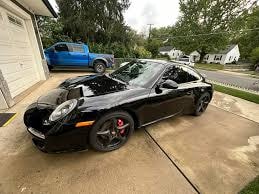 AGV Mobile Car Detailing — black sports car hood open after engine detail